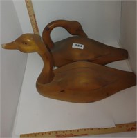 large wooden duck and napkin rings with holder