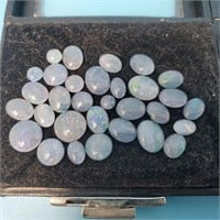 Assorted Opalescent Gemstones with Display Cases