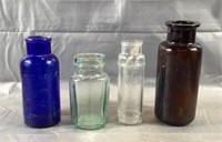 Lot of 4 various color vintage bottles