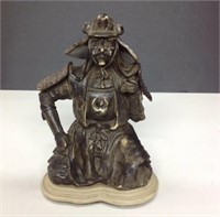 Resin statuette of kneeling samurai