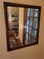 Wood framed beveled mirror. 22"× 27"