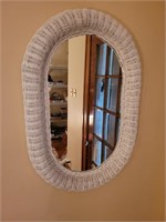 Wicker framed mirror. 19"×28"