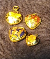 A group of necklace pendants