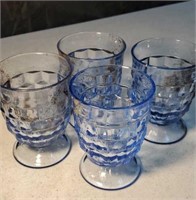 4 light blue drinking glasses