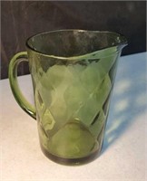 Green glass pitcher approx 8 inches tall