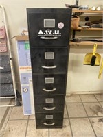 Black filing cabinet, auto repair books, gun part