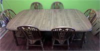 Wooden dining room table with six chairs