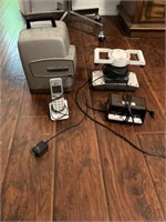 Vintage projector, AT&T phone, two alarm clocks,