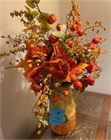 Fall colors floral arrangement with ceramic vase