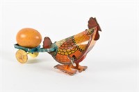CHICKEN PULLING EGG ON CART TIN LITHO WIND-UP TOY