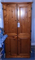 Lot #1021 - Pine four door storage cabinet