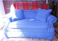 Lot #1094 - Blue upholstered sleeper loveseat