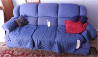 Lot #1107 - Blue upholstered three cushion sofa