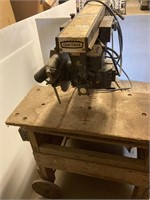 Sears radial arm saw on stand. Works.