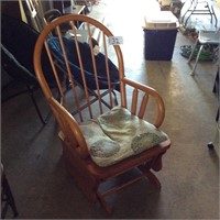 Wooden rocker with cushion
