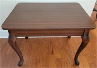 Particle board side table with wood legs