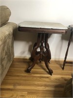 Wooden table with marble top