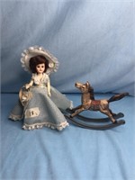 Vintage doll and metal rocking horse