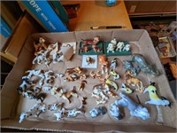 Large flat of tiny glass animals mostly dogs