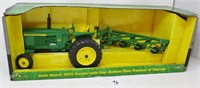 JD 3020 tractor with four bottom plow