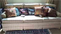 Sofa with decorative pillows approximately 81”