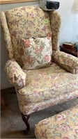 Chair with matching ottoman and decorative pillow