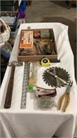 Hammer, saw blade, tape measure, drill bits,