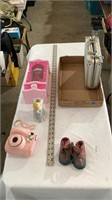 Barbie closet, baby shoes, Polaroid camera,