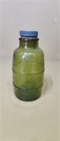 Green glass barrel bottle with cork top