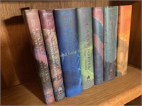 Set of seven Harry Potter hard cover books