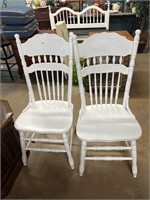 2 white press back chairs