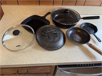 A couple of Lodge Lids and 2 other iron skillets,