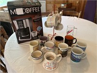Mr. Coffee Maker in the box with mugs and cups.