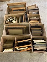 Miscellaneous types and sizes of picture frames.