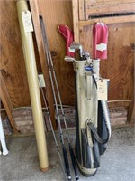 Two Berkeley fishing rods, golf bag with some