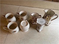 3 Cash Family pottery pitchers and 4 cups