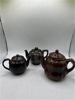 Three Brown Ceramic Teapots