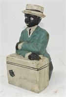 Black Americana cast iron bank, man with suitcase