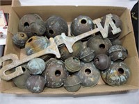 Box of brass weathervane balls and parts