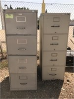 Pair of four-drawer metal filing cabinets. Shows