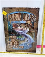 A Fisherman Lives Here Tin Sign