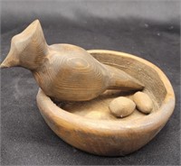 Hand craved wood bird with eggs and nest. 5"