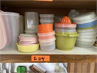 1 shelf of Tupperware bowls and lids.