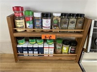 Wooden spice rack with spices.