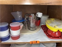 Shelf of misc kitchen containers.