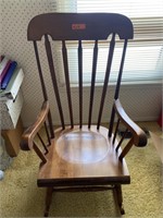 Wood rocking chair. width: 20 in. Depth: 19 in.