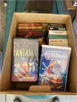 Box of misc VHS, CDs and Cassette tapes.