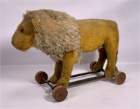 Lion pull toy, wooden wheel on iron frame (fur on