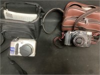 Olympus and Canon Cameras with Bags