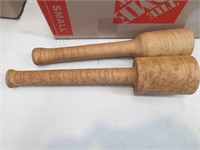 two wooden turned mallets or mashers